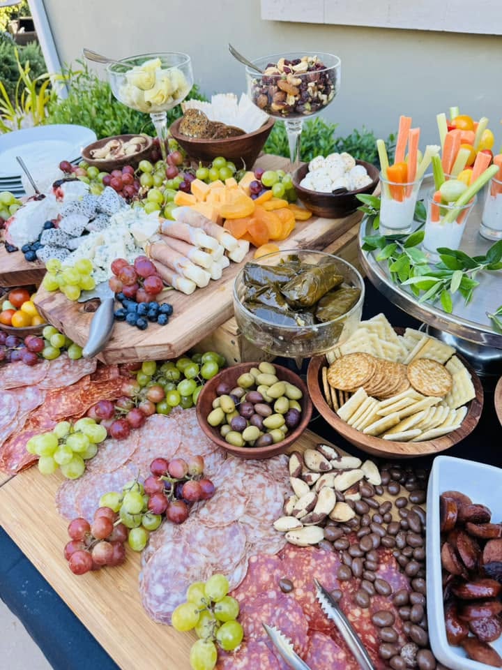 Garden grazing spread with cheeses, salumi, dolmas and crudité